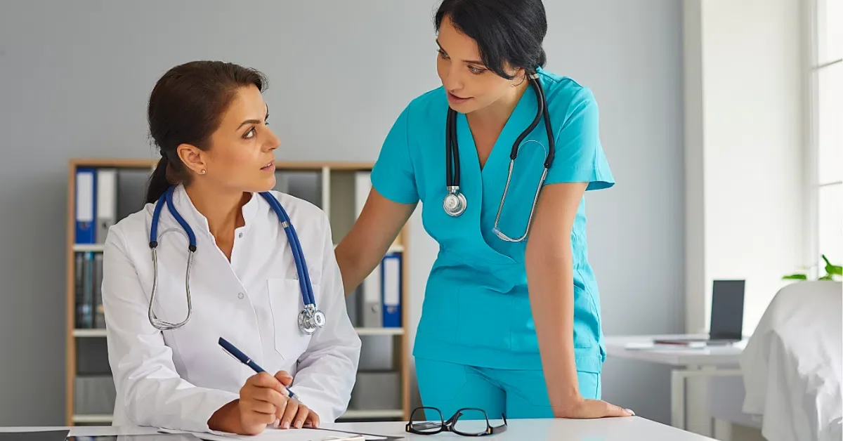 A physician and a nurse reviewing a patient's notes together